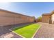 Artificial turf and brick patio backyard at 16221 S 35Th Dr, Phoenix, AZ 85045