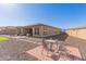 Relaxing backyard oasis featuring a patio, hammock, and rock landscaping at 16221 S 35Th Dr, Phoenix, AZ 85045