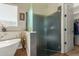 Modern bathroom with a walk-in shower and frameless glass enclosure at 16221 S 35Th Dr, Phoenix, AZ 85045