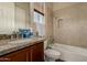 Bathroom boasts granite vanity, bathtub, and tiled shower at 16221 S 35Th Dr, Phoenix, AZ 85045