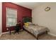 Bright bedroom with a double bed, desk, and large closet at 16221 S 35Th Dr, Phoenix, AZ 85045