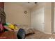 Cozy bedroom featuring a double bed, built-in shelving, and plush bedding at 16221 S 35Th Dr, Phoenix, AZ 85045