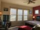 Spacious bedroom with three large windows, a king-size bed, and a relaxing atmosphere at 16221 S 35Th Dr, Phoenix, AZ 85045