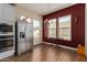 Bright breakfast nook with hardwood floors and a view from kitchen at 16221 S 35Th Dr, Phoenix, AZ 85045