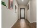 Bright entryway with wood-look floors and an elegant door at 16221 S 35Th Dr, Phoenix, AZ 85045