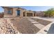 Landscaped front yard with a brick pathway at 16221 S 35Th Dr, Phoenix, AZ 85045