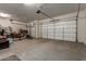 Garage with overhead door and extra storage space at 16221 S 35Th Dr, Phoenix, AZ 85045