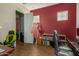 Home office with built-in shelving and wood floors at 16221 S 35Th Dr, Phoenix, AZ 85045