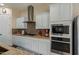 Modern kitchen featuring stainless steel appliances and light-colored cabinetry at 16221 S 35Th Dr, Phoenix, AZ 85045