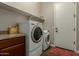 Laundry room with washer, dryer, and granite countertop at 16221 S 35Th Dr, Phoenix, AZ 85045