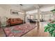 Elegant living room with ornate couch and view into kitchen at 16221 S 35Th Dr, Phoenix, AZ 85045