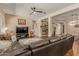 Relaxing living room with sectional sofa and large TV at 16221 S 35Th Dr, Phoenix, AZ 85045