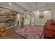 Living room showcasing a wood accent wall and area rug at 16221 S 35Th Dr, Phoenix, AZ 85045