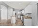 Modern kitchen with granite countertops and white cabinets at 16671 W Mckinley St, Goodyear, AZ 85338