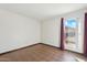 Simple bedroom with window and wood-look flooring at 1886 E Bendix Dr, Tempe, AZ 85283