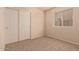 Simple bedroom with closet and neutral carpet at 1922 N Wildflower Ln, Casa Grande, AZ 85122