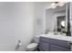 Modern bathroom with gray vanity and a large mirror at 19231 W Missouri Ave, Litchfield Park, AZ 85340