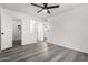 Spacious bedroom with gray flooring, a ceiling fan, and a walk-in closet at 1942 S Emerson -- # 231, Mesa, AZ 85210