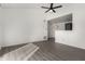 Living room with wood-look floors, high ceiling, and access to kitchen at 1942 S Emerson -- # 231, Mesa, AZ 85210