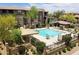 Community pool with lounge chairs and shade structures at 19777 N 76Th St # 1237, Scottsdale, AZ 85255