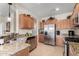 Modern kitchen with stainless steel appliances and granite countertops at 21271 N 262Nd Dr, Buckeye, AZ 85396