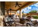 Spacious backyard patio featuring a fire pit and comfortable seating at 21271 N 262Nd Dr, Buckeye, AZ 85396