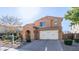 Two-story home with a three-car garage and desert landscaping at 2389 E Hazeltine Way, Gilbert, AZ 85298