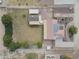 Aerial view showing house, yard, and detached garage with solar panels at 2419 S 200Th Ln, Buckeye, AZ 85326