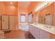 Bathroom with double sinks, shower, and bathtub at 2419 S 200Th Ln, Buckeye, AZ 85326