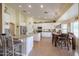 Open kitchen with island, white cabinets, and granite counters at 2419 S 200Th Ln, Buckeye, AZ 85326