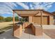 Outdoor kitchen with a pergola and built-in grill at 2419 S 200Th Ln, Buckeye, AZ 85326