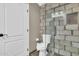 Modern bathroom with a large glass shower and updated fixtures at 2458 E Roma Ave, Phoenix, AZ 85016
