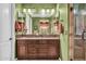Double vanity bathroom with spacious countertop and walk-in shower at 2458 E Roma Ave, Phoenix, AZ 85016
