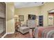 Relaxing bedroom sitting area with comfortable chair and ottoman at 2458 E Roma Ave, Phoenix, AZ 85016