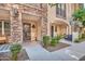 Inviting exterior of townhome with stone accents and landscaped walkway at 2458 E Roma Ave, Phoenix, AZ 85016