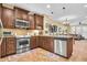 Open kitchen boasting stainless steel appliances and a breakfast bar at 2458 E Roma Ave, Phoenix, AZ 85016