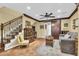 Open living area with hardwood floors, stylish furnishings, and a staircase at 2458 E Roma Ave, Phoenix, AZ 85016