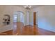 Hardwood floors and an arched doorway to another room at 310 W Campbell Ave, Phoenix, AZ 85013