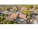 Aerial view of a house showcasing pool, patio, mature trees, and surrounding neighborhood at 3457 E Ellis St, Mesa, AZ 85213
