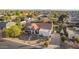 An aerial view of a charming single-Gathering home set amidst lush greenery in a residential neighborhood at 3457 E Ellis St, Mesa, AZ 85213