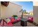 Relaxing outdoor patio with comfortable seating, modern fire pit, and well-maintained landscaping at 3457 E Ellis St, Mesa, AZ 85213