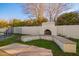 This backyard has an outdoor fireplace with seating perfect for gatherings, by the pool at 3457 E Ellis St, Mesa, AZ 85213