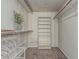 Walk-in closet equipped with shelving, rods, and carpet flooring at 3457 E Ellis St, Mesa, AZ 85213