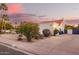 View of the driveway on a one story home with desert landscaping at 3457 E Ellis St, Mesa, AZ 85213