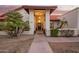 Inviting front entrance with decorative pillars and desert landscaping features at 3457 E Ellis St, Mesa, AZ 85213