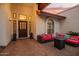 Inviting front entrance with tiled flooring, decorative lions, and a charming stained-glass door at 3457 E Ellis St, Mesa, AZ 85213