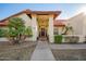 Charming single-story home featuring a red tile roof, manicured landscaping, and a welcoming entryway at 3457 E Ellis St, Mesa, AZ 85213