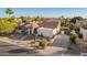 A wide driveway and desert landscaping highlight the facade of this Southwestern-style home at 3457 E Ellis St, Mesa, AZ 85213