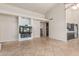 Open living space featuring a built-in media center, tile flooring, and access to other rooms at 3457 E Ellis St, Mesa, AZ 85213