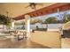 Spacious covered patio with an outdoor kitchen featuring a built-in grill, perfect for entertaining guests at 3457 E Ellis St, Mesa, AZ 85213